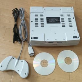 Sega Saturn console, software, and controller set.