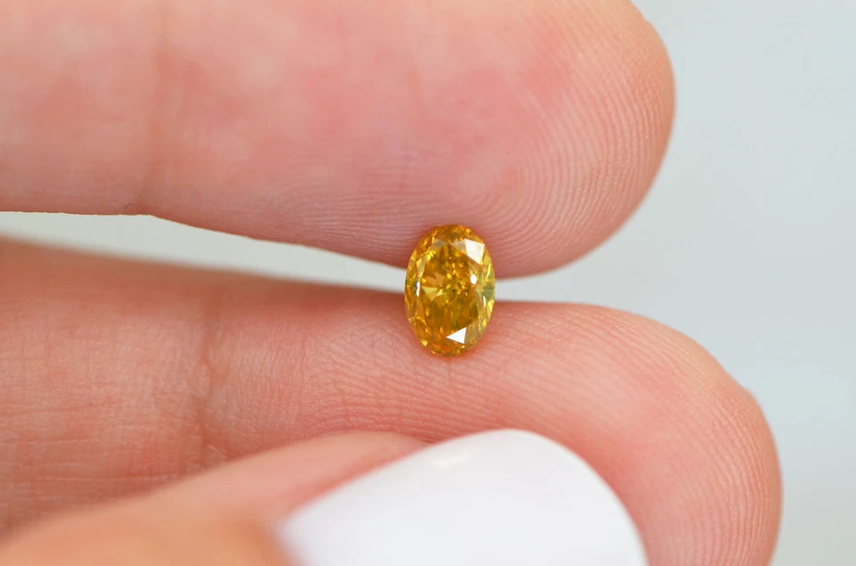 Fancy Orangey Yellow Diamond Loose Oval Shape VS1 Natural Enhanced 0.53 Carat - Image 2 of 4