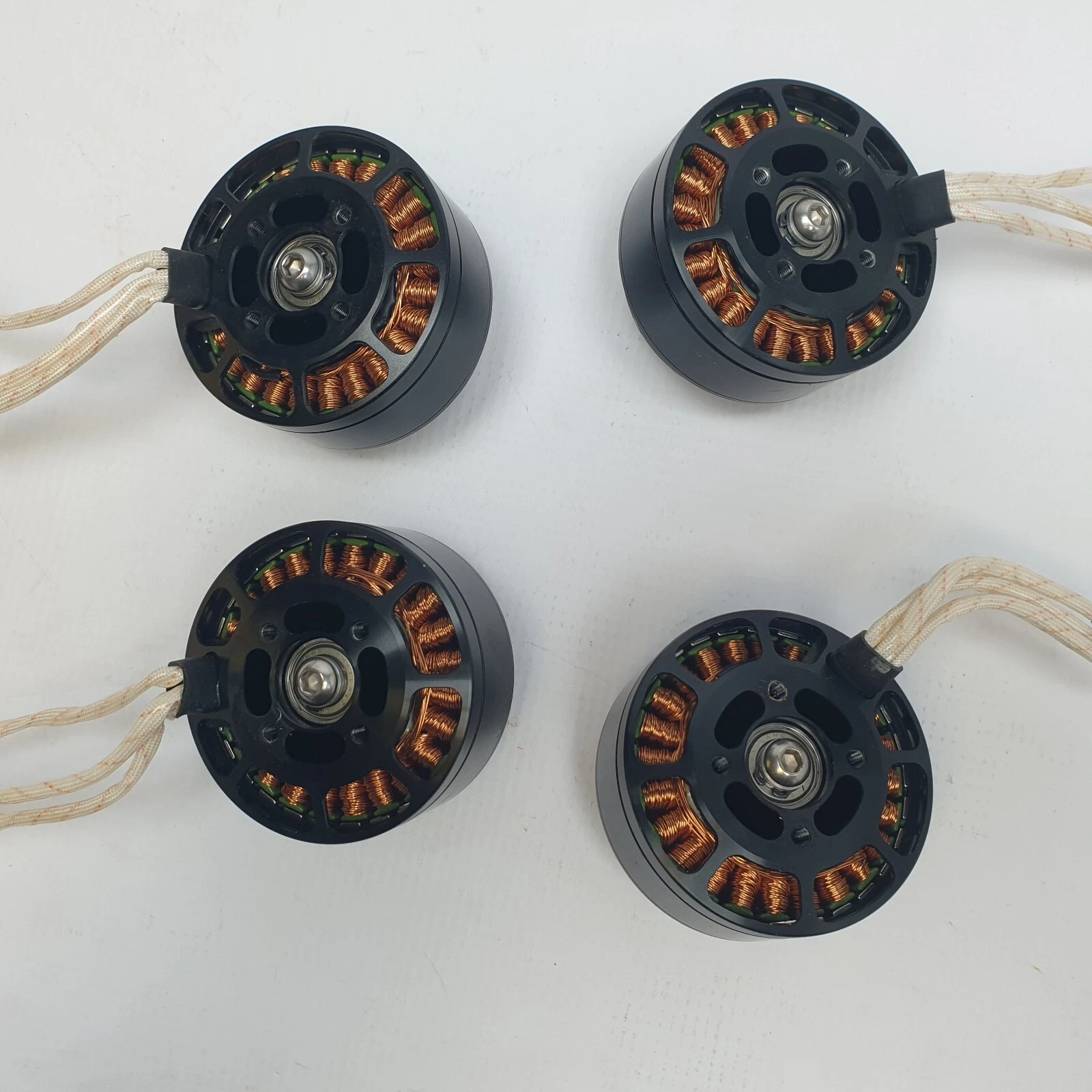 Bases of the four KV170 motors showing windings and rear bearings