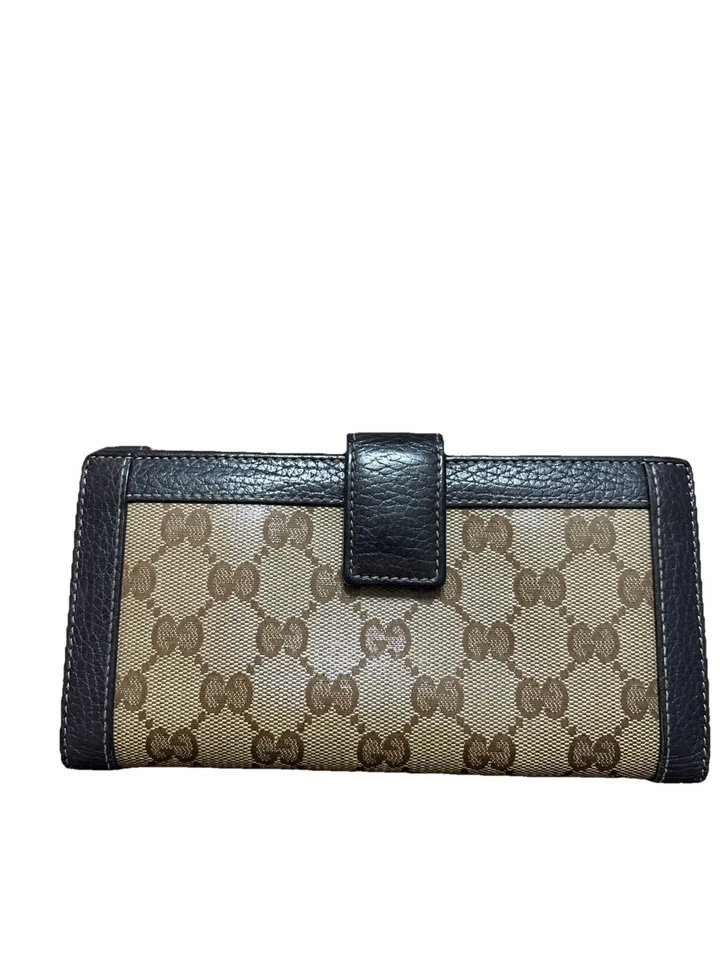 Cartera larga Gucci GG monograma lona con ribete de cuero. Foto 2 de 4