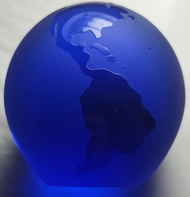 Cobalt blue art glass world globe paperweight.