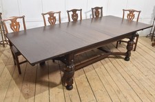 Oak extending dining table by Maple and Co