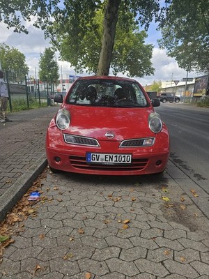 Nissan Micra in red. The car runs and drives, but is sold without TÜV