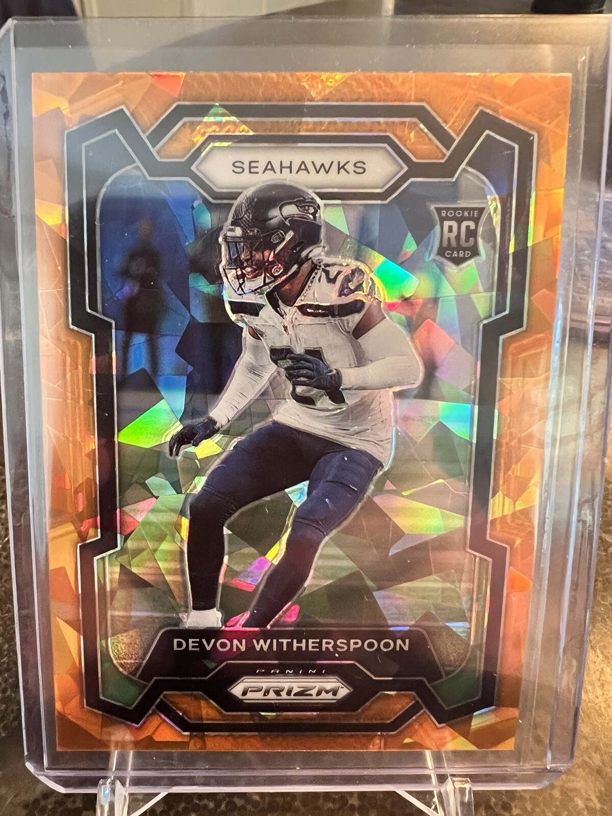 2023 Panini Prizm Football Devon Witherspoon SSP Orange Cracked Ice Rookie 389