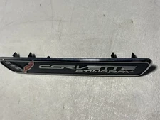 2014-2019 C7 CORVETTE "CORVETTE STINGRAY" CENTER CONSOLE EMBLEM LOGO GM 23198496