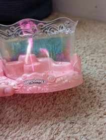Hatchimals collectibles Pink/Clear Display Case with 8 color changing figures.