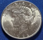 A 1922 BU UNCIRCULATED SILVER PEACE DOLLAR.  FLASHY!