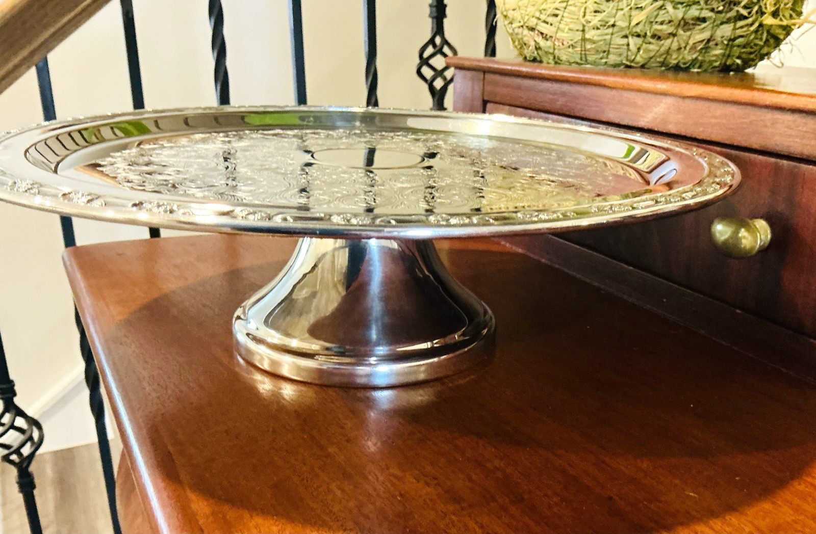 Oneida Versailles silver plate footed pedestal serving tray on a white background.