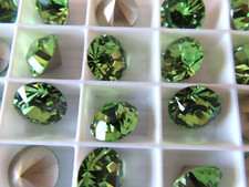 24 Swarovski XILION Rhinestones 47ss Peridot/foiled. 1028