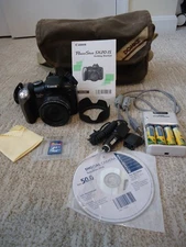 Canon PowerShot SX20 IS 12.1MP Digital Camera Bundle Very Nice - Untested