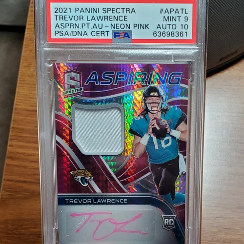 2021 Panini Spectra - Aspiring Patch Autographs Neon Pink Prizm #APA-TL Trevor Lawrence /15 (AU, MEM, RC)