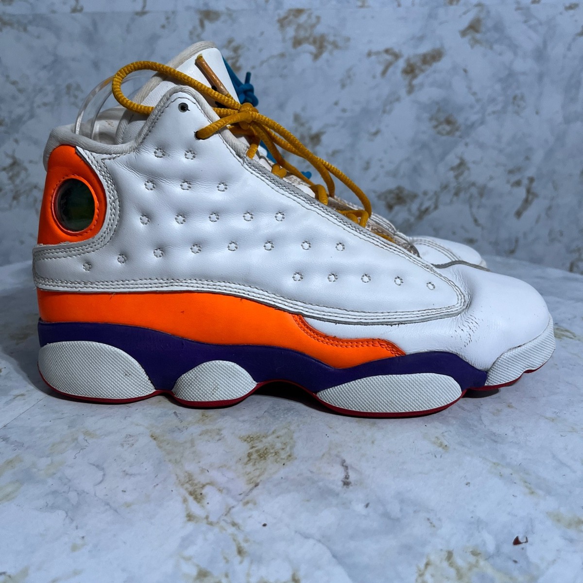 orange black and white jordan 13