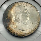 1960 P Franklin Half Dollar with peripheral toning and light rainbow qualities