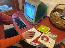 1999 Apple iMac G 3 Gumdrop Green computer with discs keyboard mouse