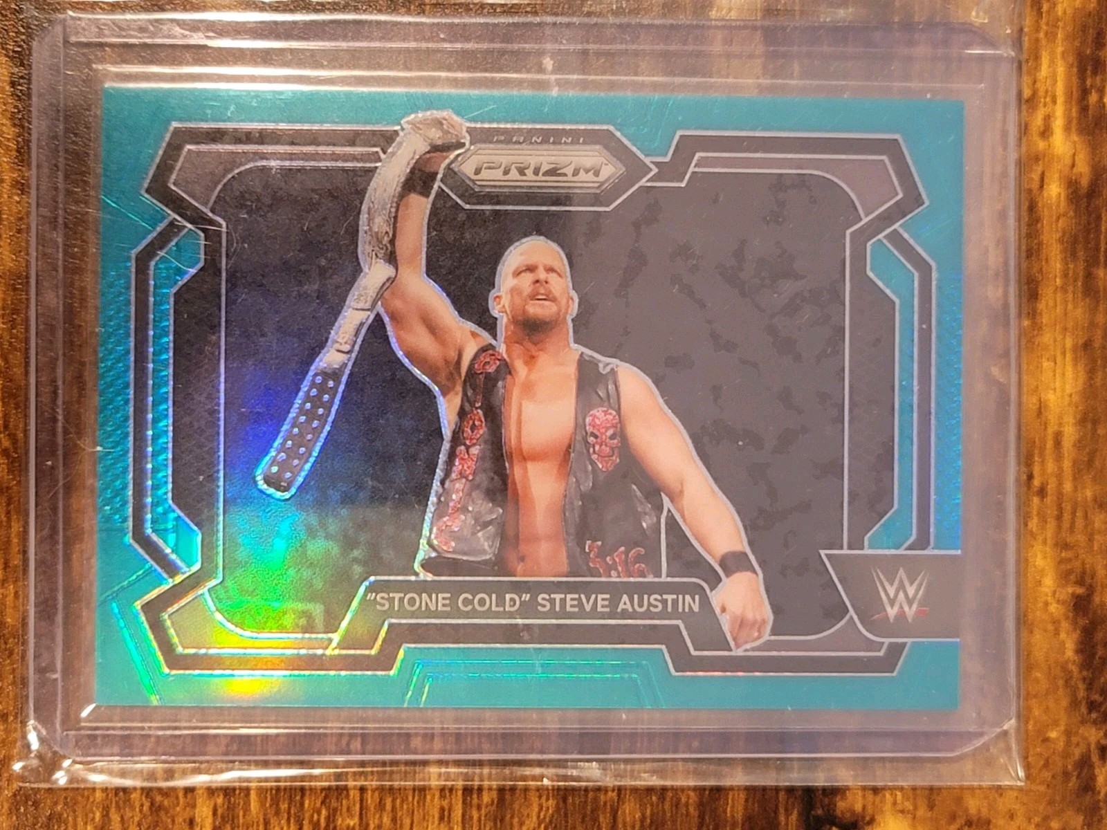 2024 Panini Prizm WWE Steve Austin #14 Teal Prizm /49