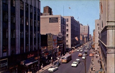 St Catherine Street ~ Montreal Quebec Canada ~ 1950s cars buses shoe store signs