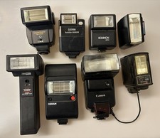 LOT OF 8 VTG CAMERA FLASHES ASSORTED BRANDS UNTESTED- SOLD AS IS FOR PARTS  0954