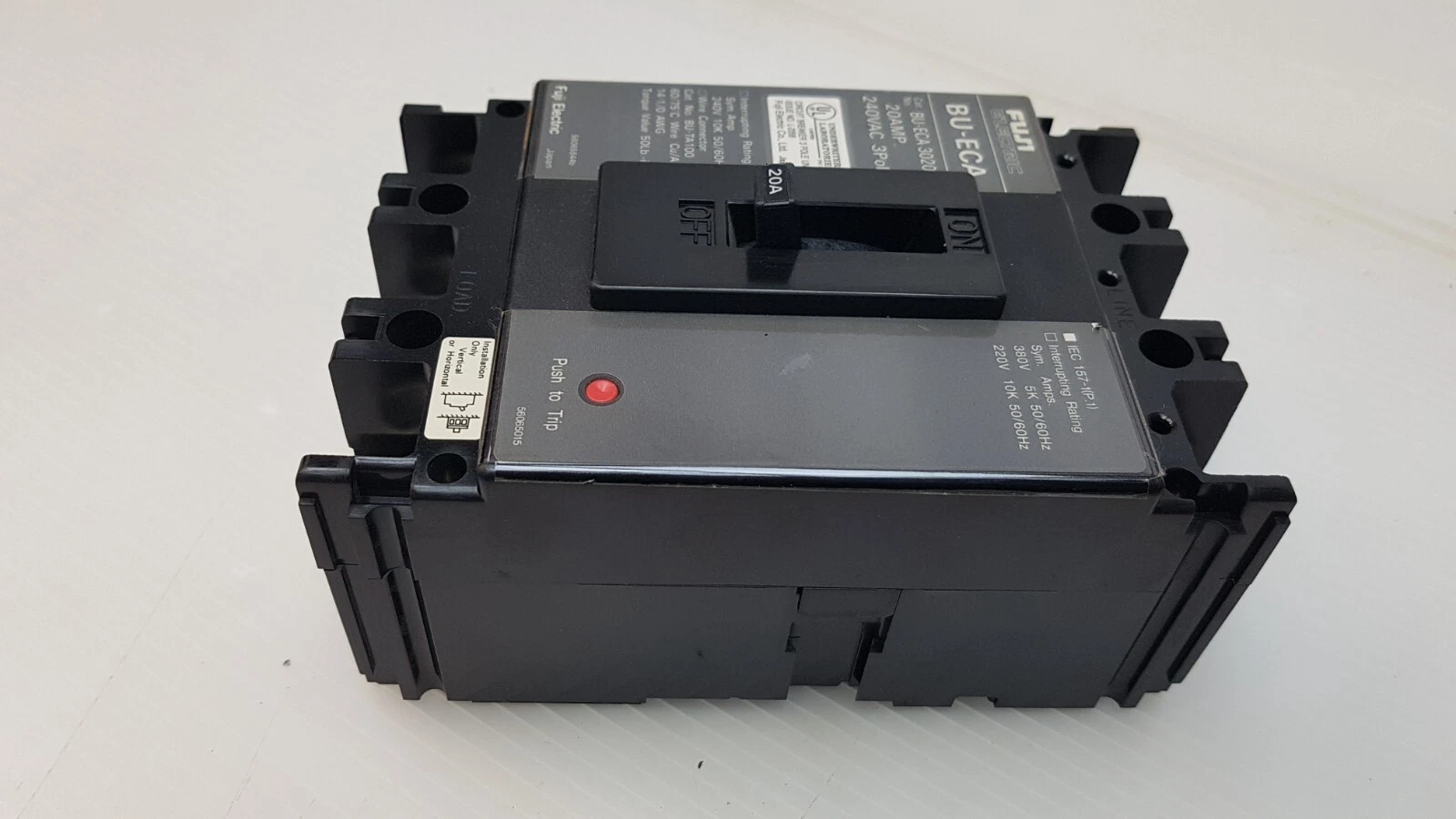 Fuji BU-ECA breaker side view with Push to Trip button and IEC 157-1 label