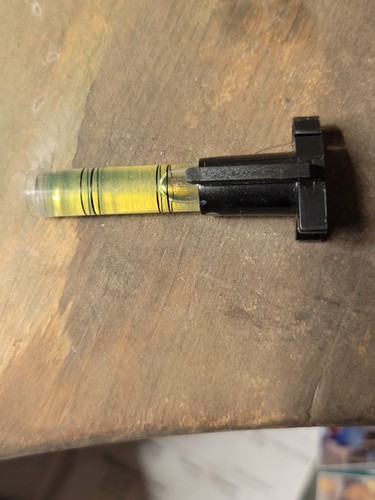 Vial from a leveling tool, likely used to determine if a surface is level