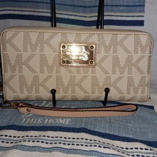 Michael Kors est.1981 wristlet logo