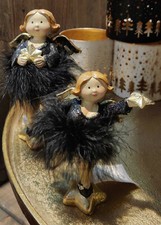 Spessa donna paffuta donna nera piuma stella