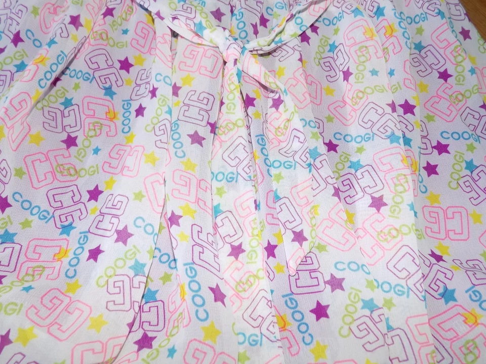 Minifalda COOGI con dobladillo de burbujas blanca magenta rosa estampado CG para niñas talla 6 usada en excelente estado Foto 2 de 4