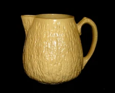 Antique (1905 - 25) Yellow Ware "Walnut" Pitcher Stoneware Brush McCoy Pottery