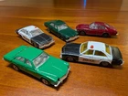 Vintage Corgi Juniors model cars, Buick Regal, police, green, dark red