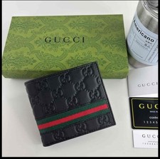 Gucci Bi-Fold Compact Wallet Never Used In Box Brand new. Black And Red Stripe.