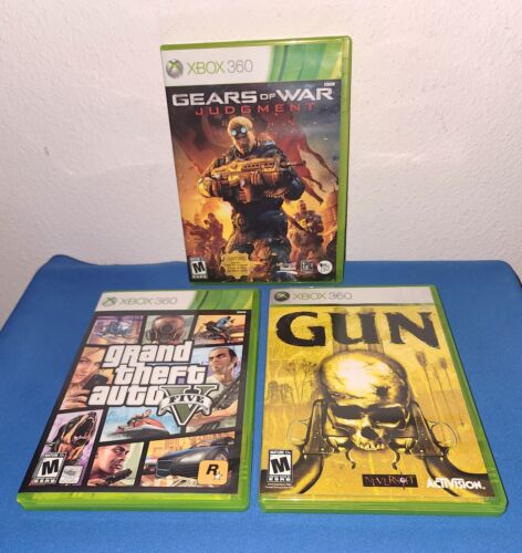 3 Xbox 360 Spiele, Waffe, Grand Theft Auto 5, Gears of War mit Handbüchern - Bild 1 von 2
