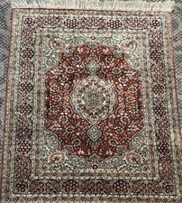 AN ATTRACTIVE SMALL SILK RUG 3’ X 2’