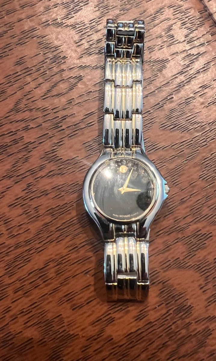 Movado silver top watch black face