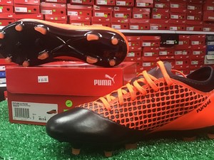 orange puma cleats