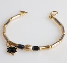 Pulsera Premium Piedras Preciosas De Hematitas Oro Y Negra con Hoja de Trebol