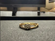 1/10 CT. T.W. Diamond Heart Cluster Ring in 10K Gold - Ring Size: 7.0