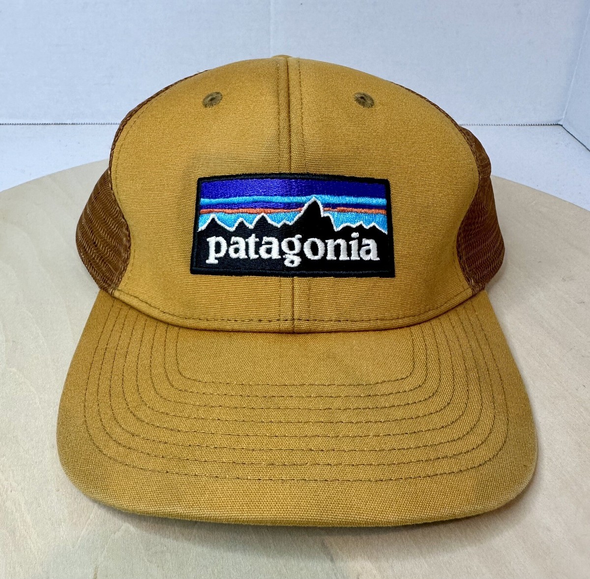 Patagonia Label Trucker Hat Snapback Gold Brown Mesh Mountains Logo