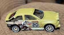 Hot Wheels 2009 Escort Rally Loose - 1:64 tan fossil fueled t-rex  C134B