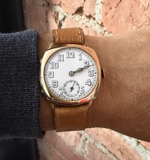 1932 9 Kt Gold Cushion Watch: Porcelain Dial,...