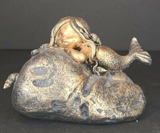 Sleeping Mermaid on Rock with shells