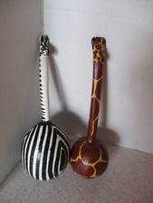 MARACAS, 2 HAND CARVED  PAINTED ANIMAL PATTERN, ZEBRA  GIRAFFE, BOTH 12" L.,VG