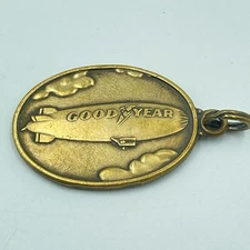 Vtg 1.25" Goodyear Tire & Rubber Co. Oval brass Mailbox drop keyring #595758