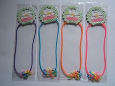 Set of 4 NEW Silicone Sili Necklaces w/Charms Girls Party Favor Toy Pink/Purple