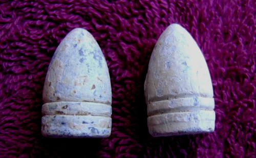 (2) EXCAVATED CIVIL UNION .56 CALIBER COLT REVOLVING RIFLE BULLETS (LaGrange,TN)