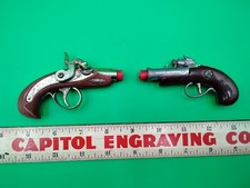 Vintage Nichols Flintlock Cap Gun And One Unmarked Flintlock Cap Gun