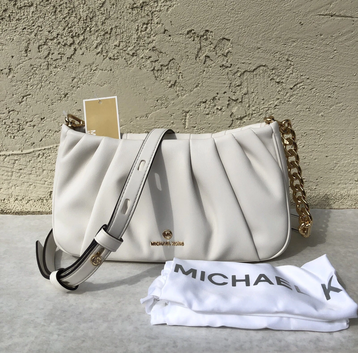 Buy the Michael Kors Leather Metal Handle Clutch Crossbody White