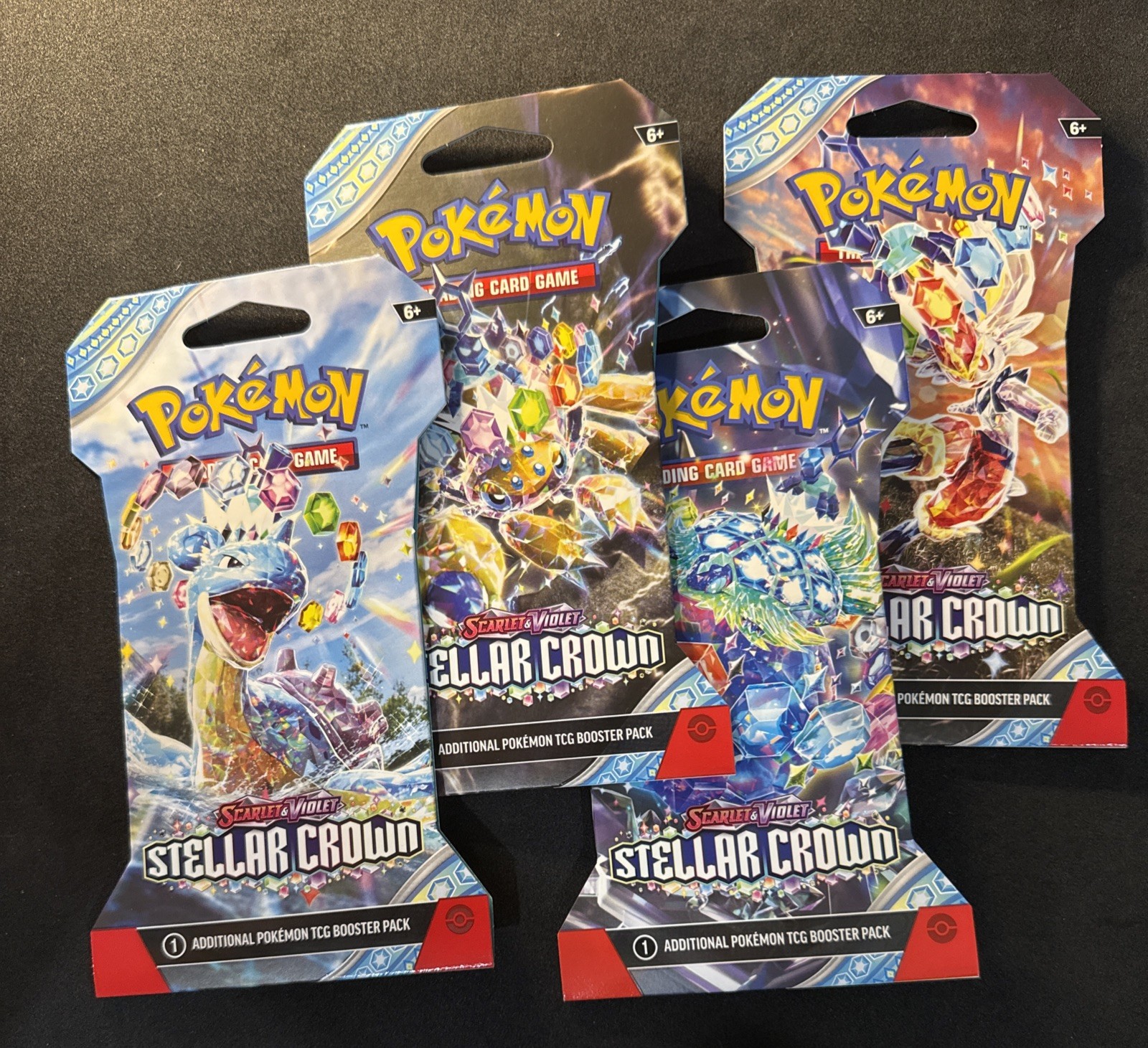 Nintendo Pokémon TCG Stellar Crown Sleeved Booster Pack Art Set. 4 Packs.