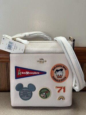 Coach x Disney Kitt Messenger crossbody with patches brass chalk