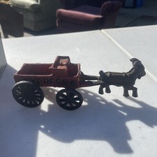 antique cast iron goat pulling express wagon
