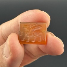 Antique old near eastern carnelian stone intaglio seal depicting winged figurine