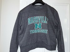 Primark Grey Varsity Style Cropped Seatshirt with Green Nashville Logo. Size S
